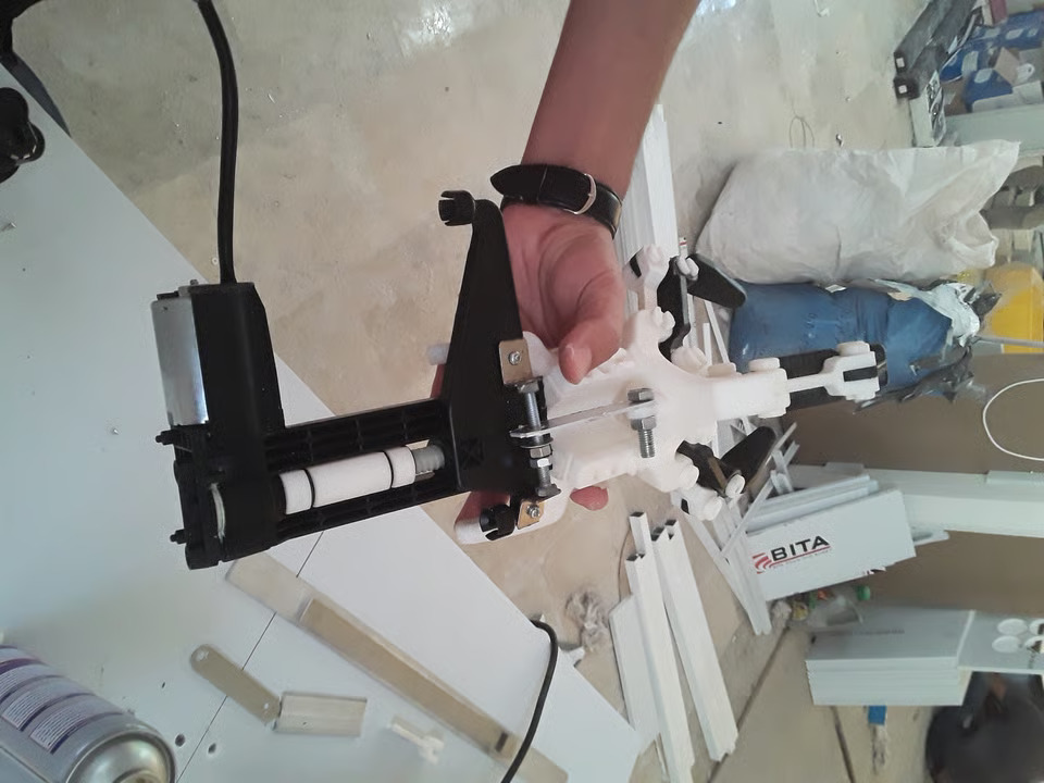 Rehabilitation exoskeleton hand prototype on a workbench